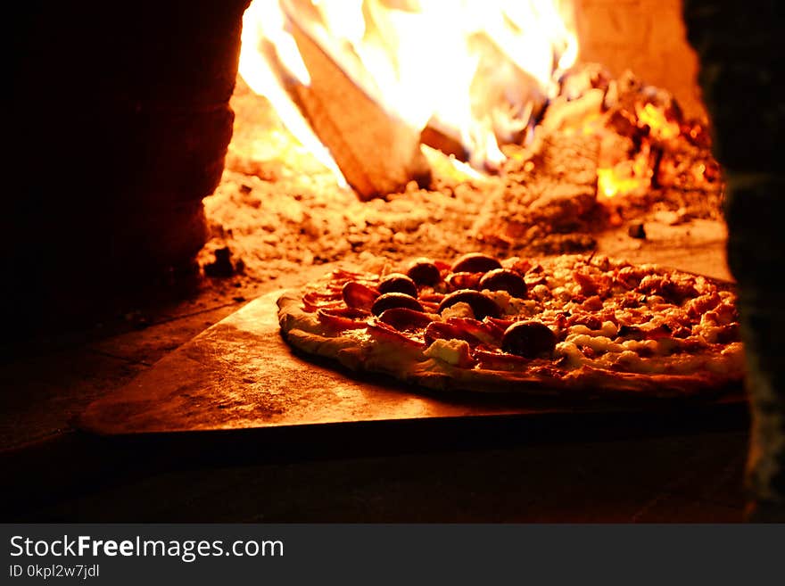 Close-up Photo of Pizza Near Bonfire