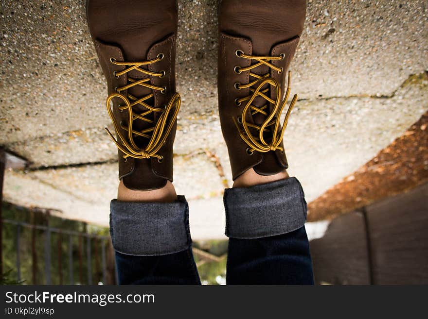 Person Wearing Brown Leather Lace-up Work Boots