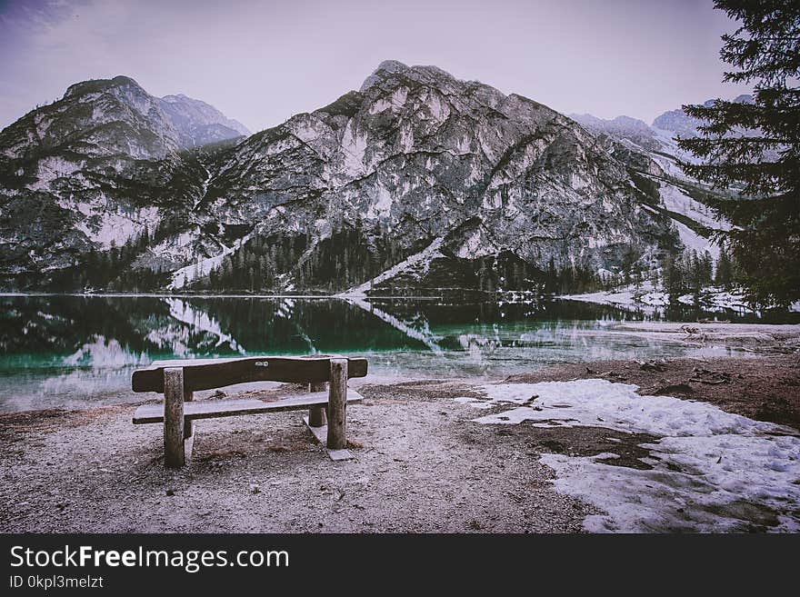 Brown Wooden Bench Near Mountain Hill