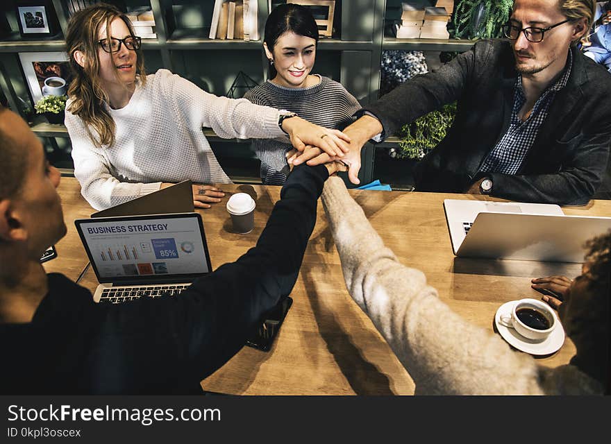 Group of People Holding Hands Forming Teamwork