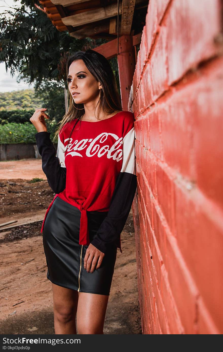 Woman Standing Beside Wall