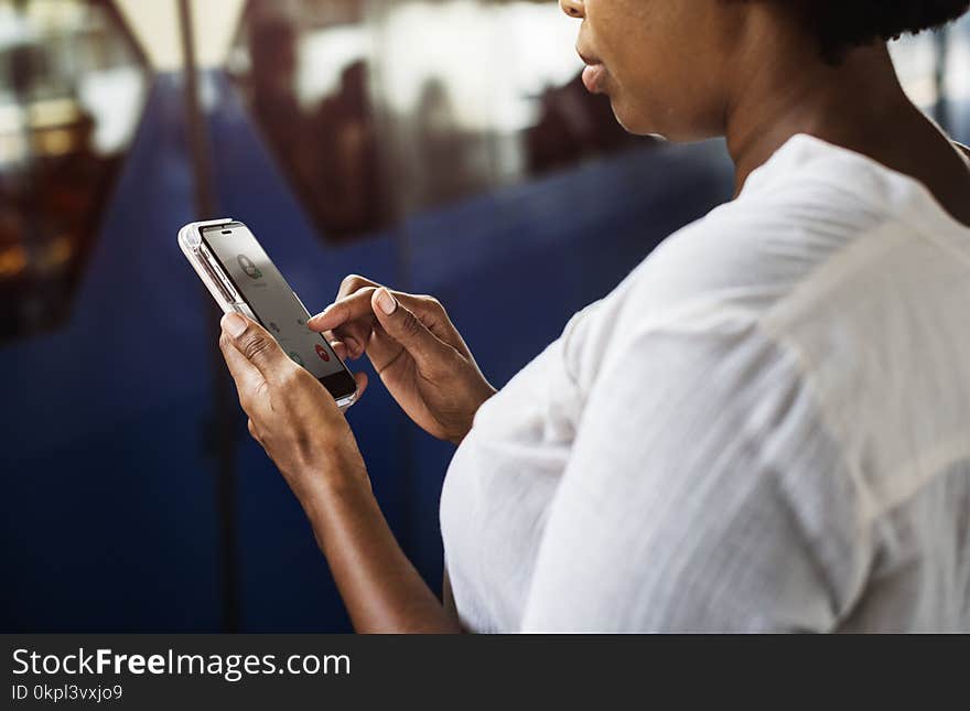 Woman Tapping on Phone