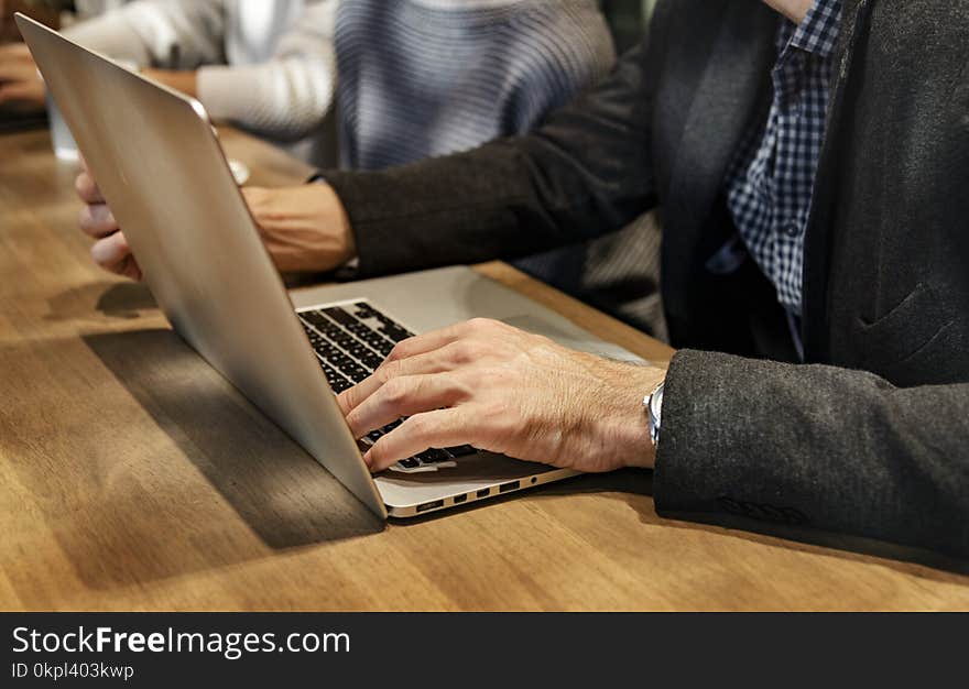 Person Using Gray Laptop Computer