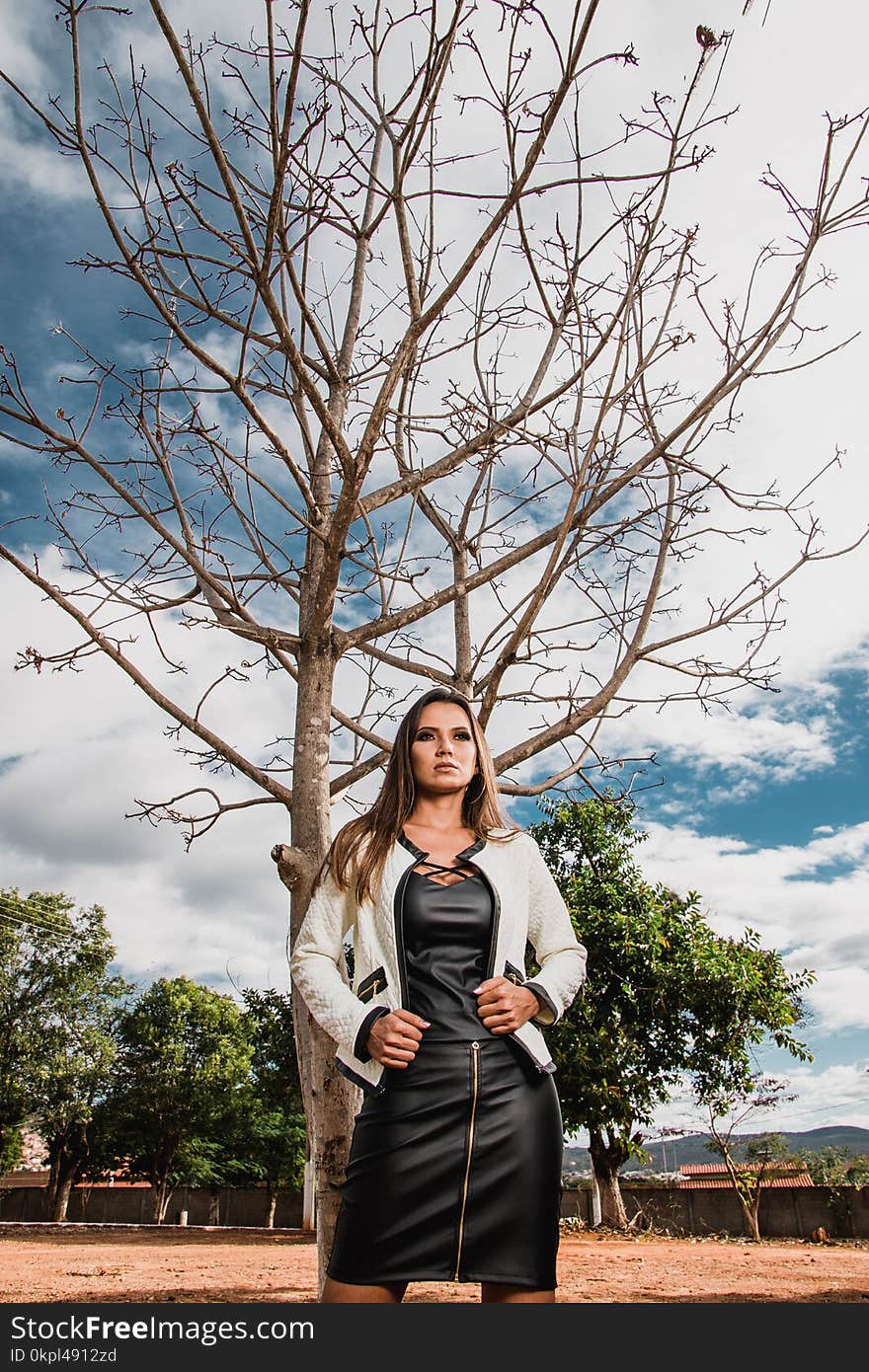 Photo Of Woman Standing Near Tree