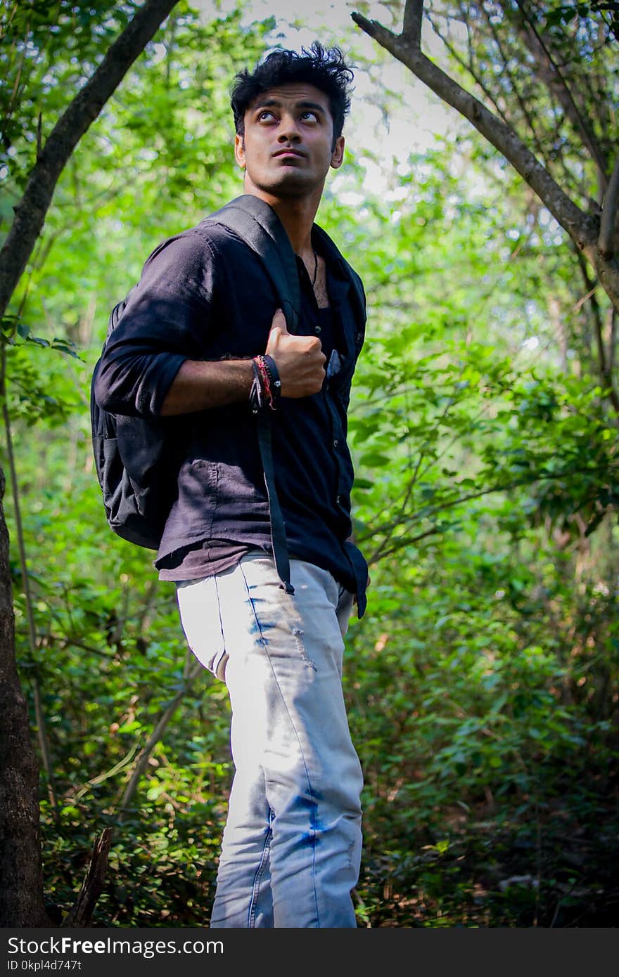 Man Wearing Long-sleeved Shirt And Blue Denim Jeans