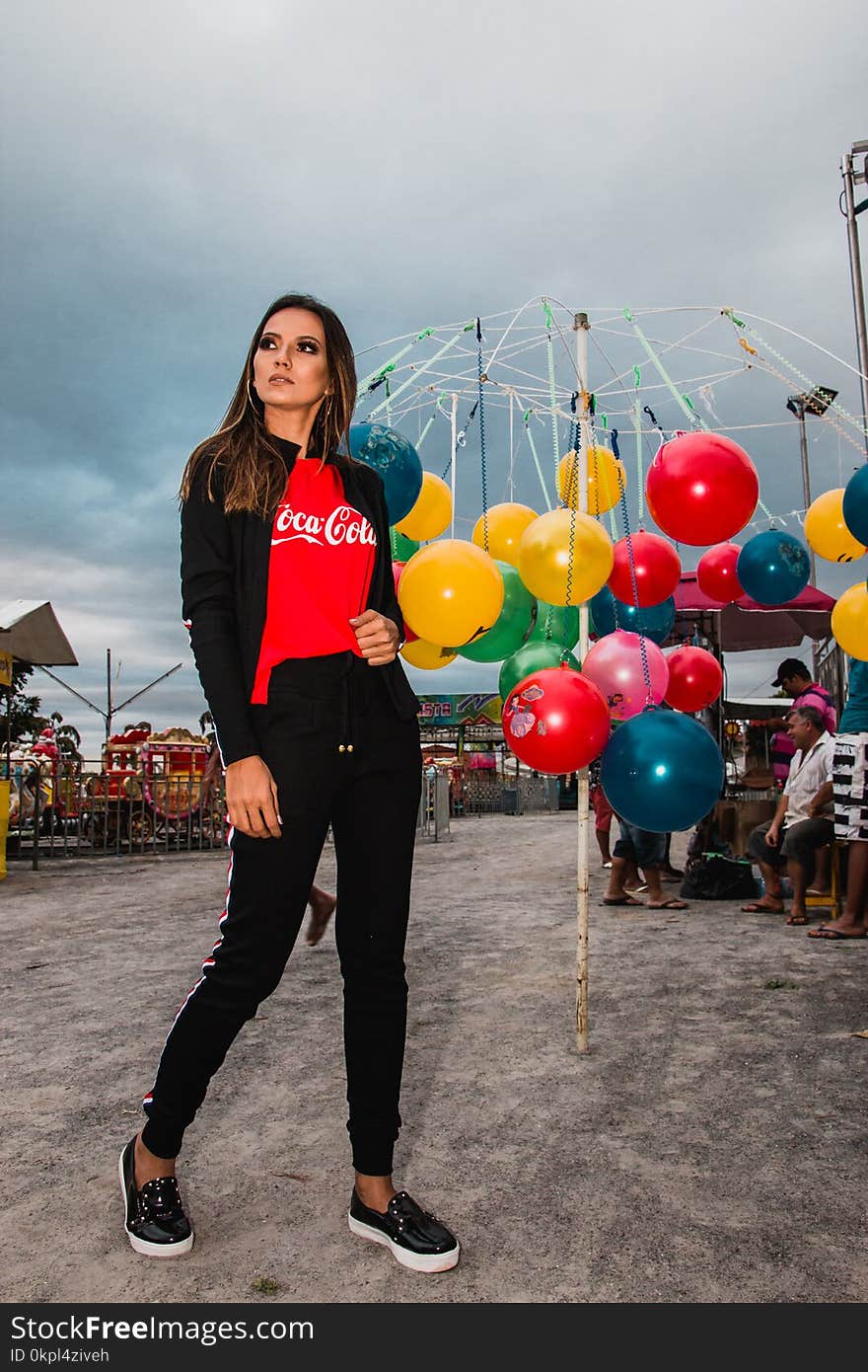 Woman Standing Near Hanging Balls