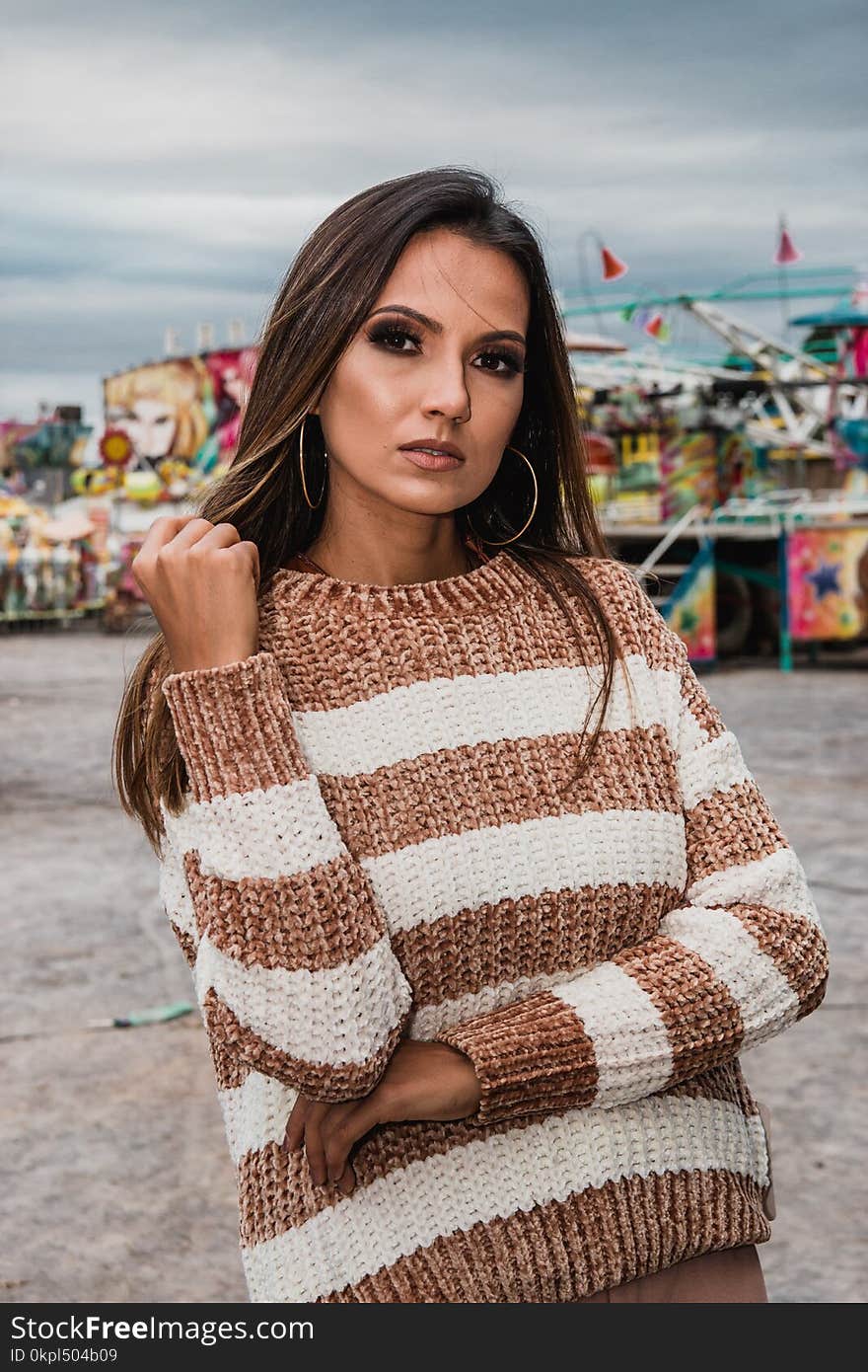 Woman Wearing Knitted White And Brown Stripe Sweater