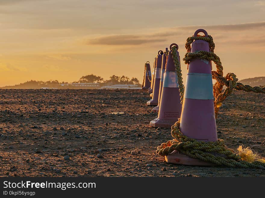 Photo of Traffic Cones with Ropes During Dusk