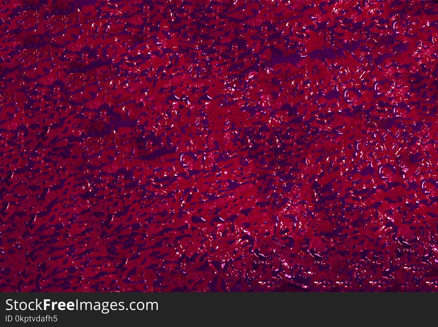 Background of purple sprouts on red paper