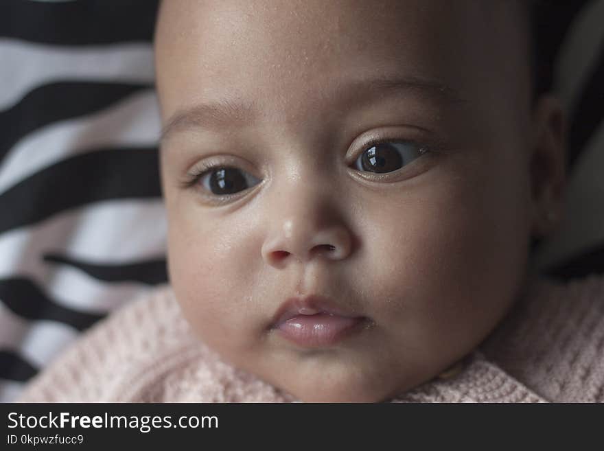 Mixed race little baby girl face close up