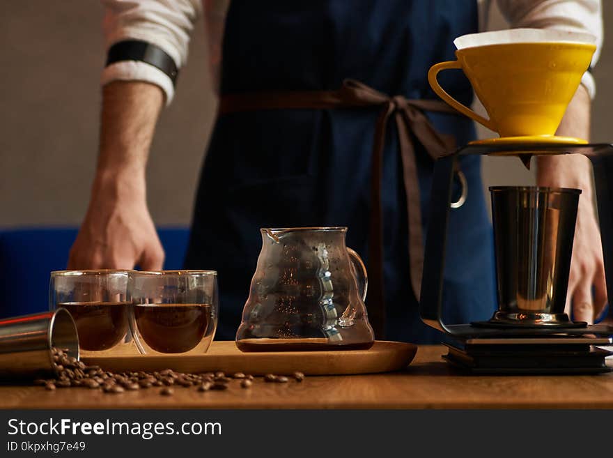 Professional Barista or coffee barman prepares coffee