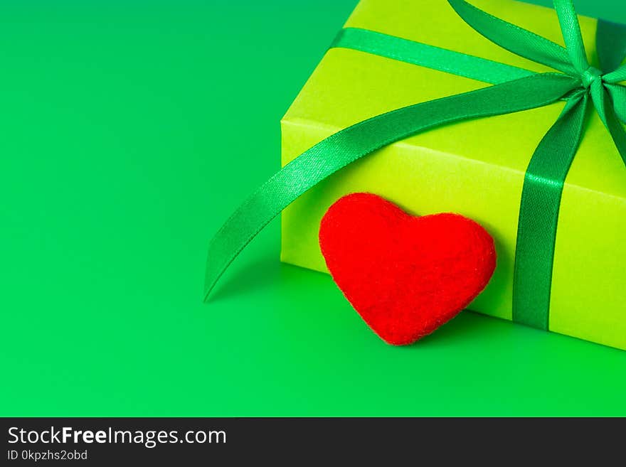 A Beautiful Green Gift And A Loving Red Heart For A Birthday