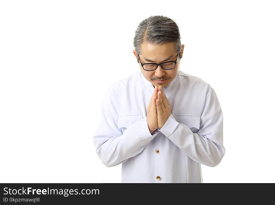 The Asian man standing on the white background with Thai classic dressed.