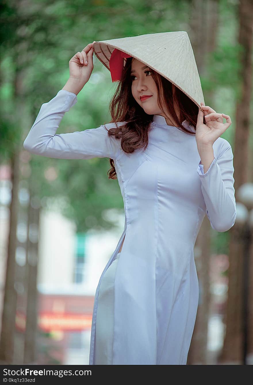 Photography of a Woman Wearing Conical Hat