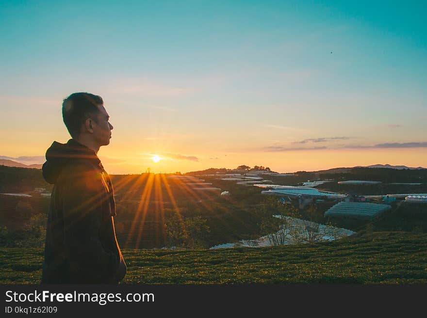 Photo of Man During Sunrise