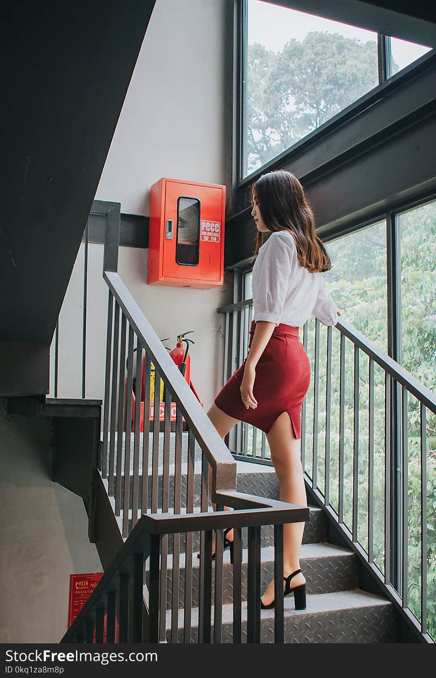 Photography of a Woman On Staircase