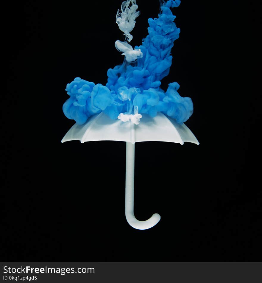 Photo of White Umbrella With Blue Smoke Illustration