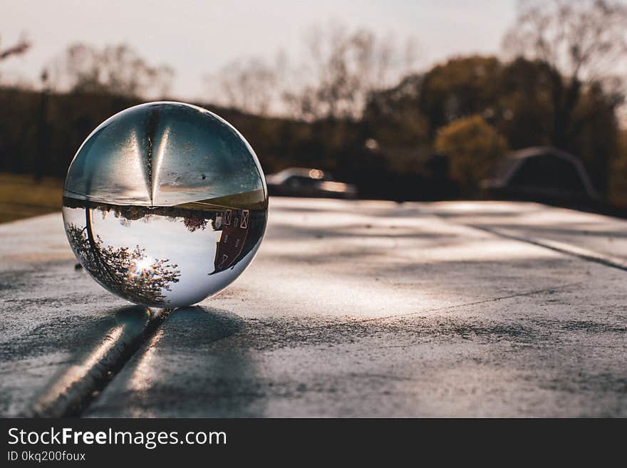 Shallow Focus Photography of Clear Glass Ball