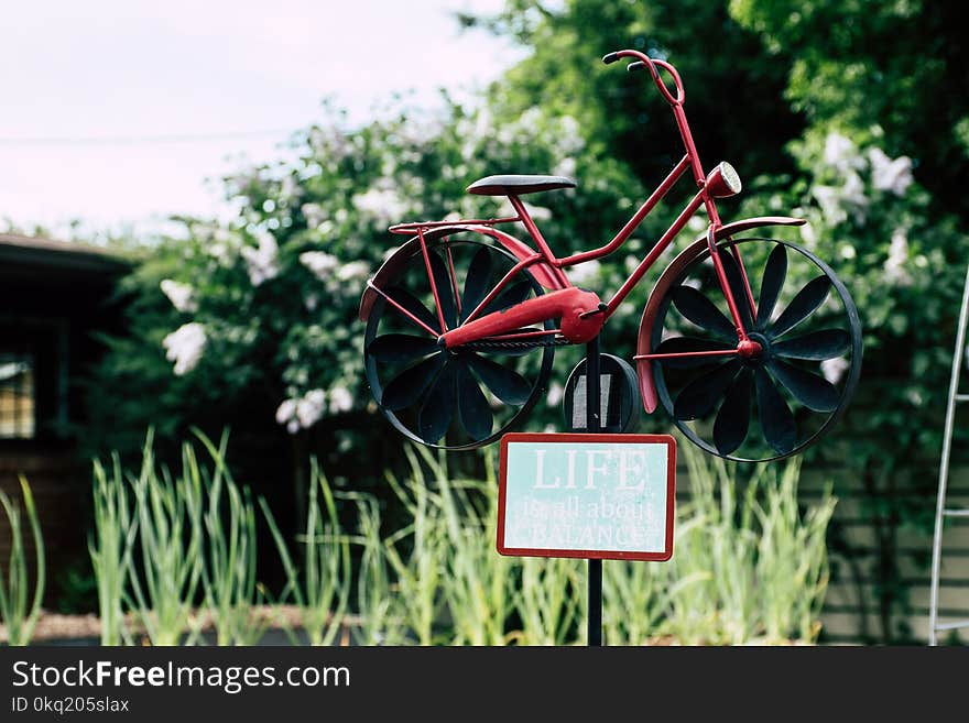 Shallow Focus Photo Red and Black Bicycle Miniature Decor