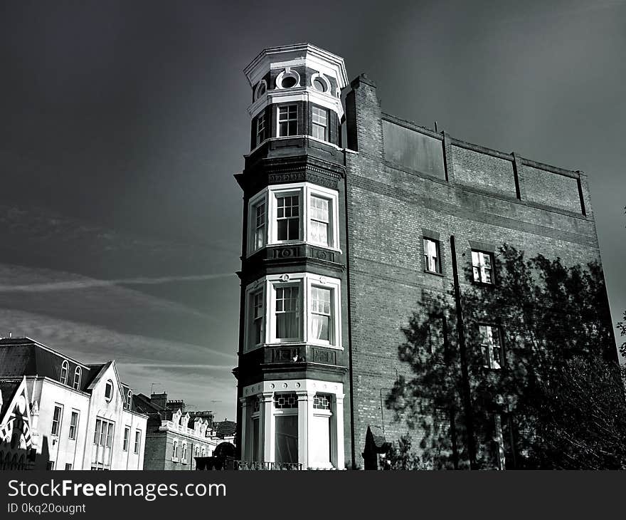 Grayscale Photo of High Rise Structure