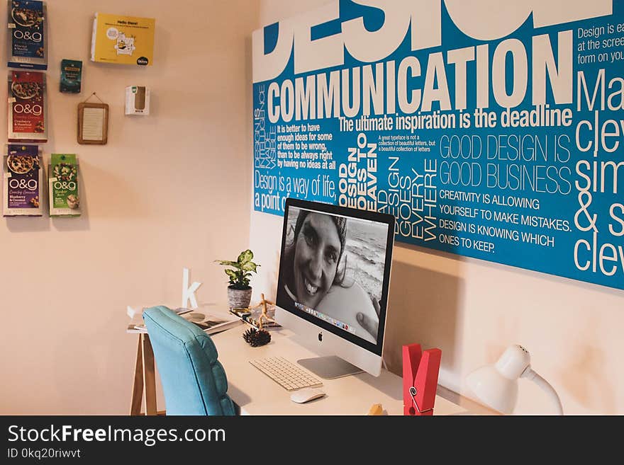 Silver Imac, Magic Keyboard, and Magic Mouse on White Wooden Table