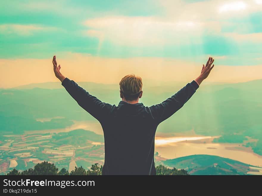 Man Standing on Mountain