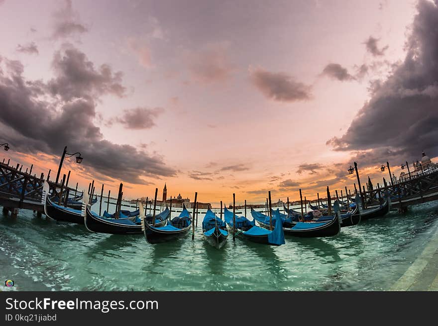 Photography of Canoes near the Dock