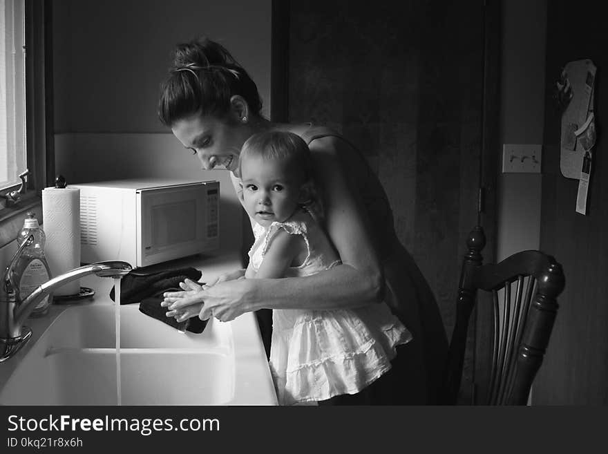 Grayscale Photography of Mother and Child