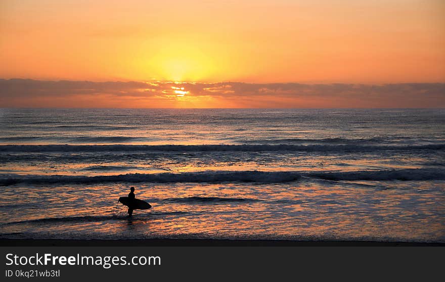 Photo of Surfer in Rule of Thirds Photography during Sunset