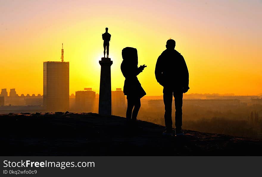 Silhouettes Of People On Warm Colorful Sunset In Belgrade, Serbia