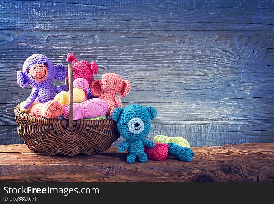 Amigurumi toys on a wooden background