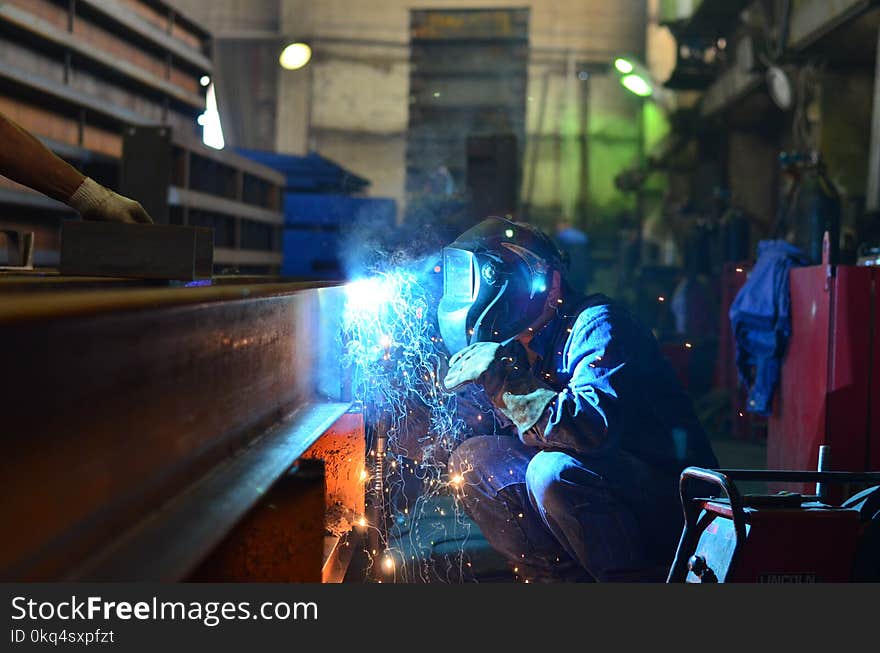 Welders work at the factory creating metal structures for industrial equipment