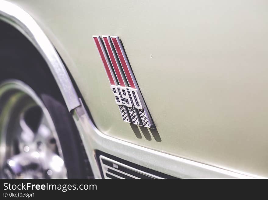 Close-Up Photography of Car Emblem