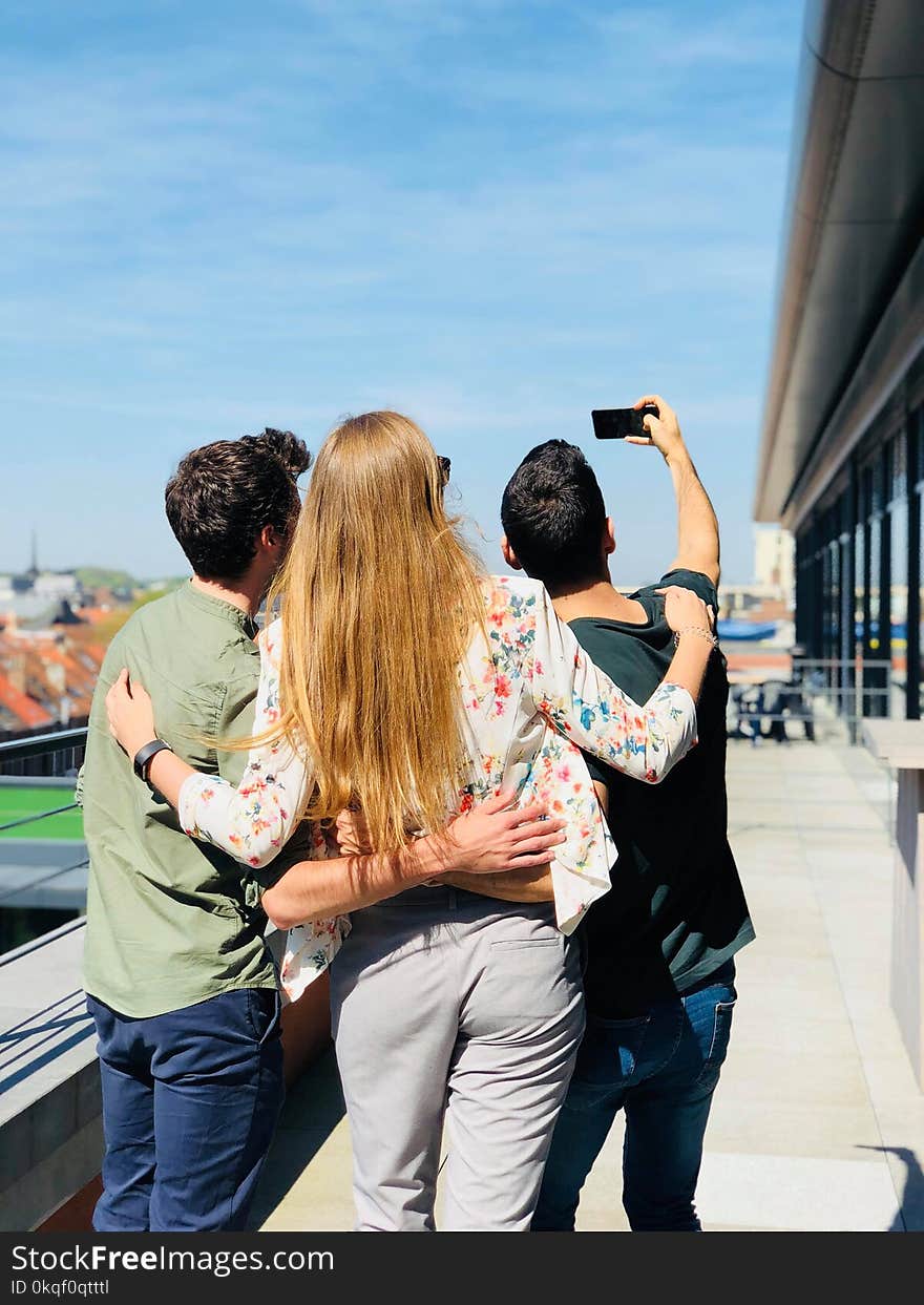 Three Person Doing Selfie Under Sunny Sky