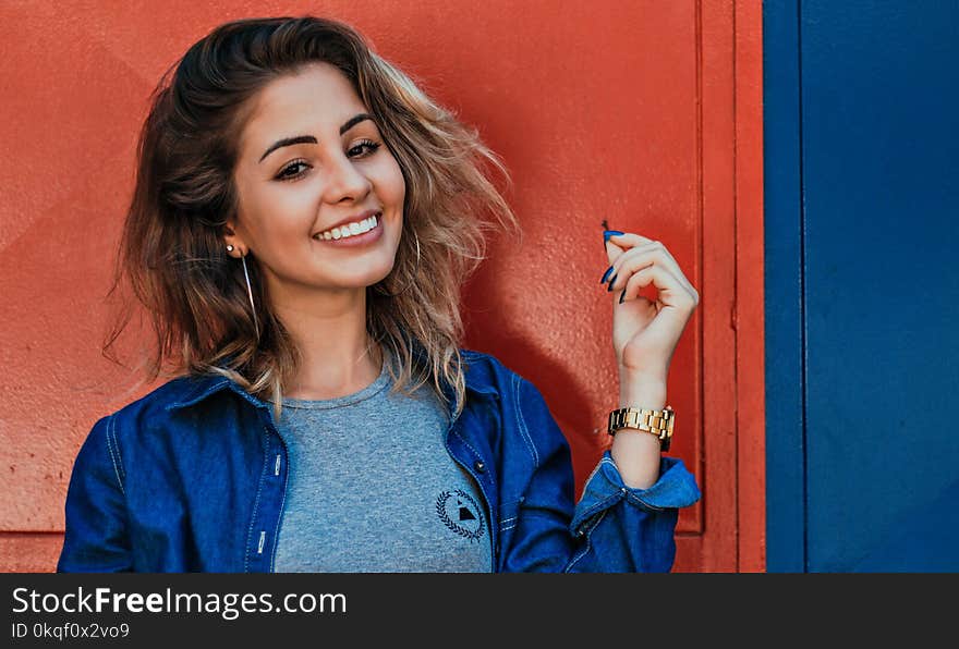 Photo of Woman Wearing Blue Zip-up Jacket