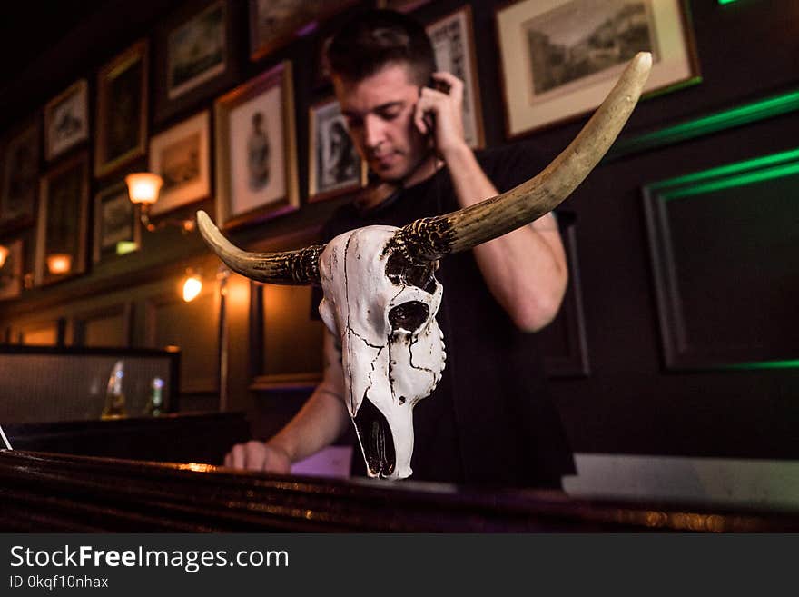 Man in Black Crew-neck Shirt Holding Smartphone