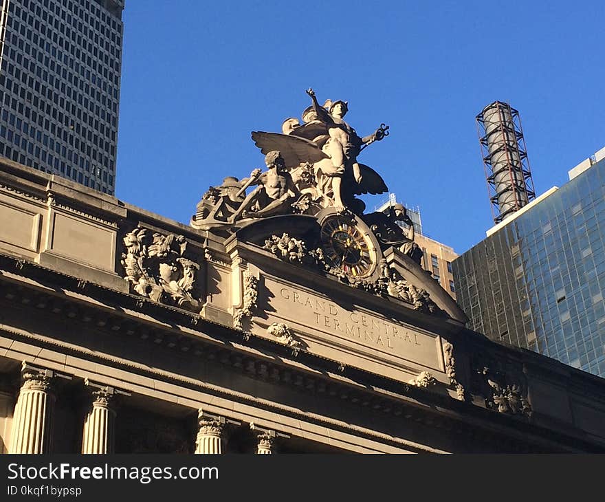 Person Standing Raising Two Hands Statue