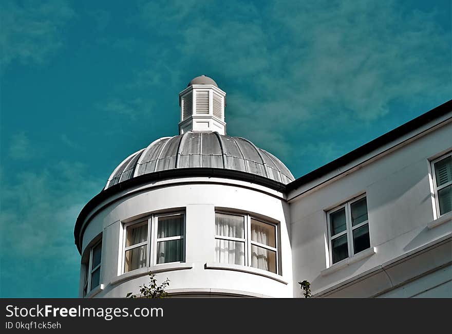 White And Grey Concrete Building Under Blue Sky