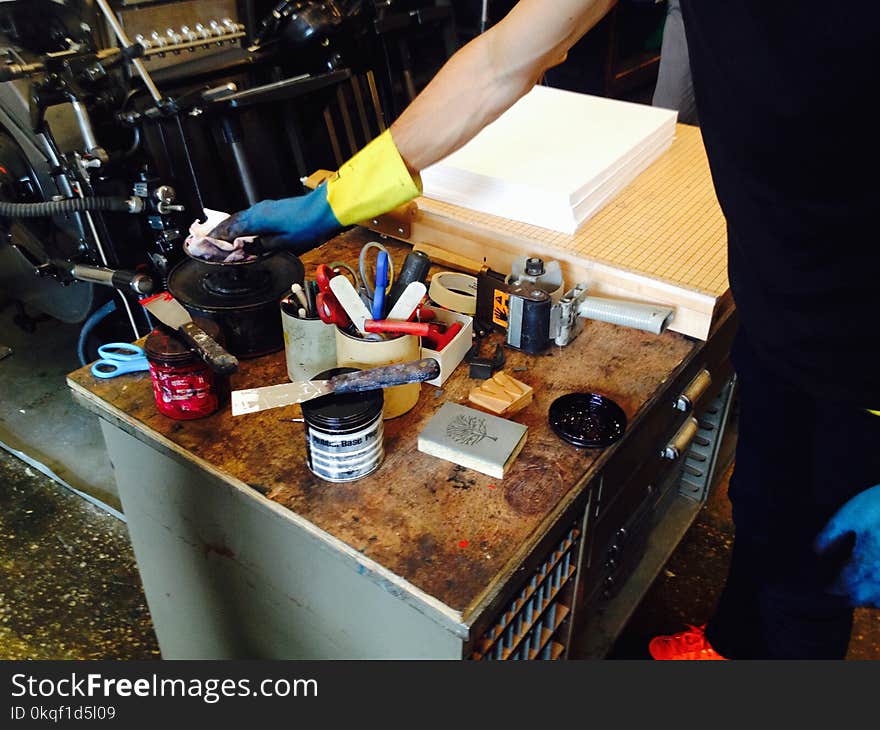 Person Holding Black Metal Container