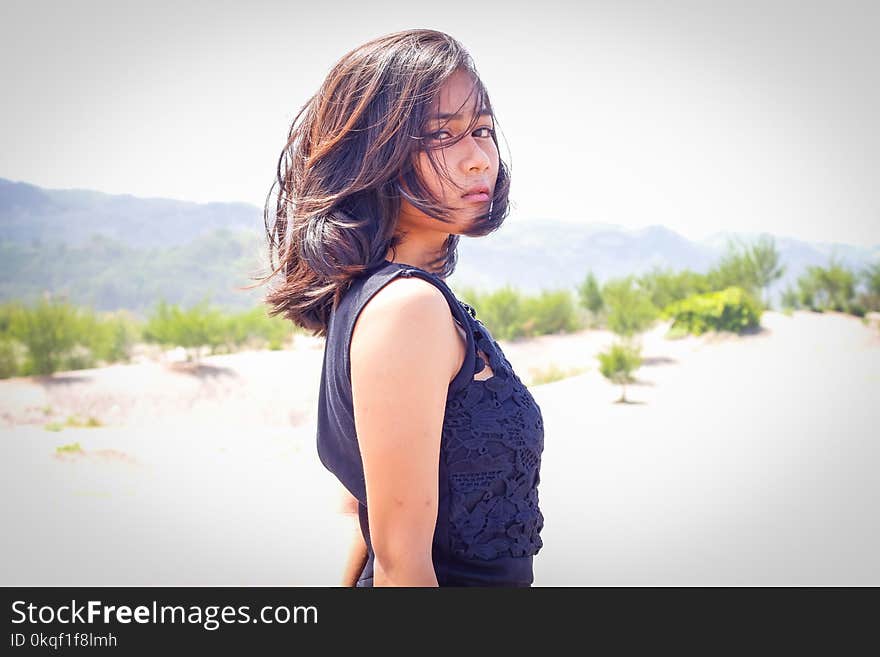 Woman in Blue Sleeveless Dress Standing on the Hill Dday