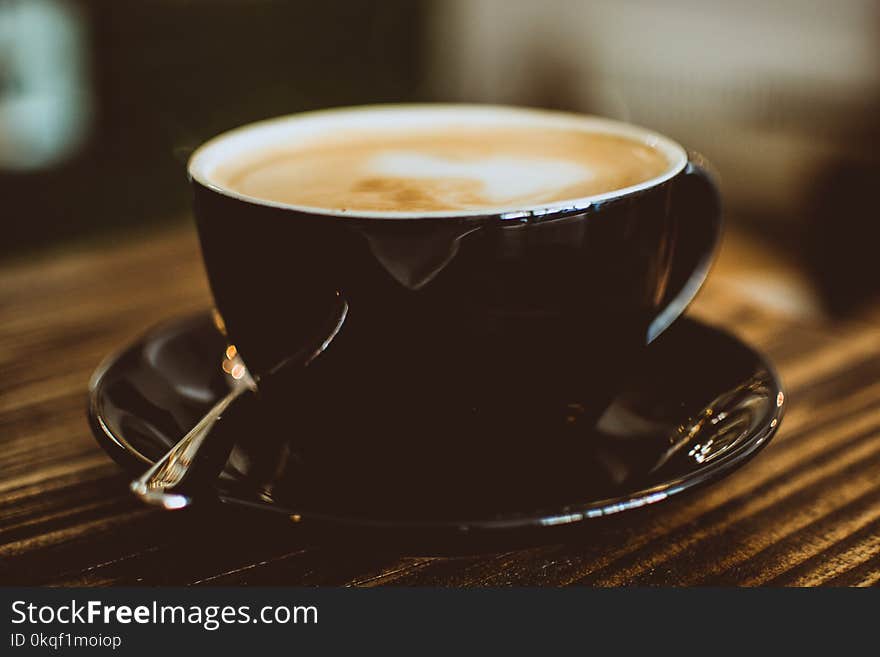 Black Ceramic Cup Filled With Latte