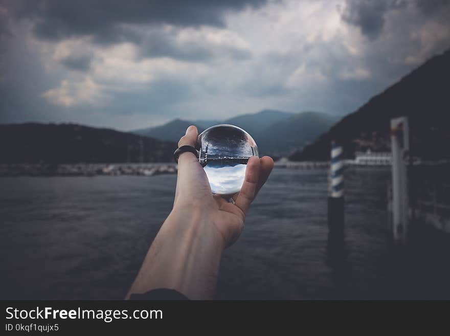 Person Holding Water Orb