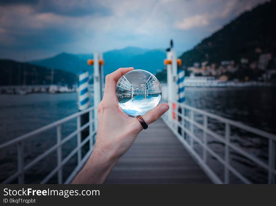 Person Holding Clear Glass