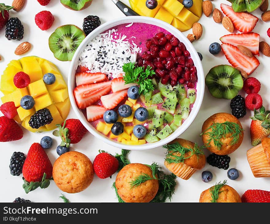 Assorted Sliced Fruits in White Ceramic Bowl