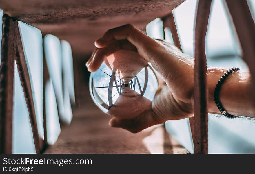 Person Holding Glass Lens