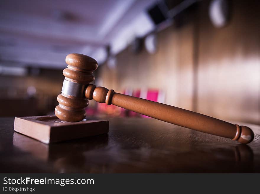 Color image of a hammer in a courtroom.