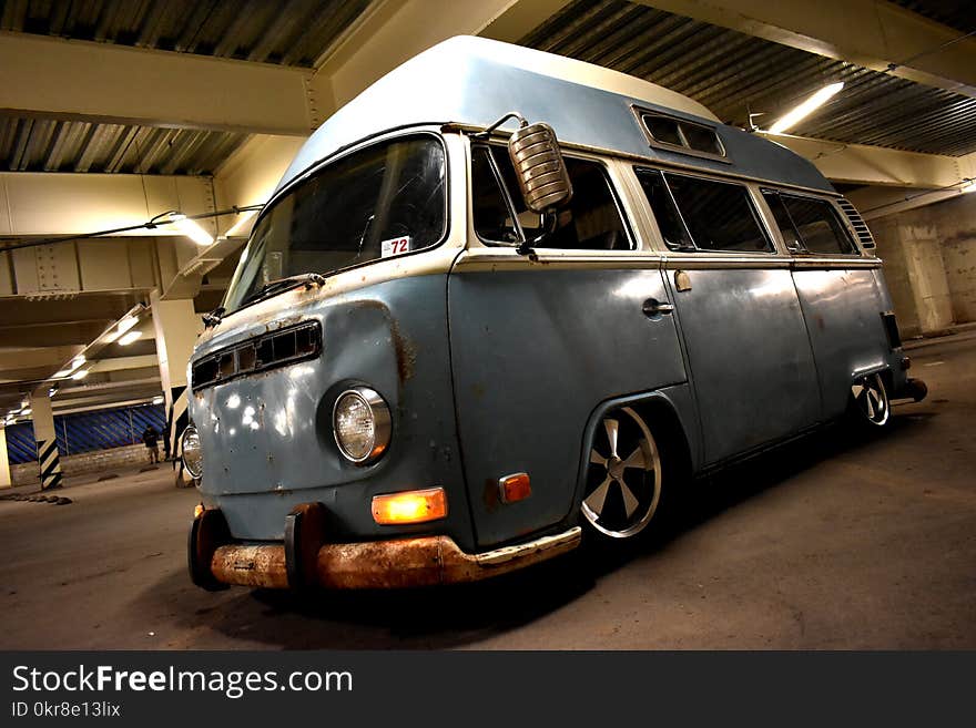 Classic Blue and White Van Parked Inside Building