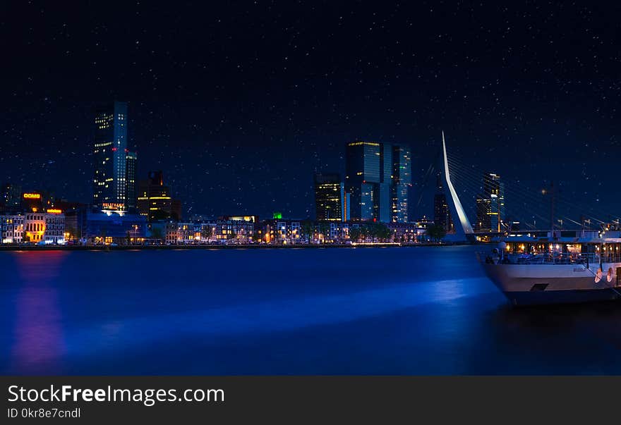 City Skyline Under Clear Sky during Nighttime