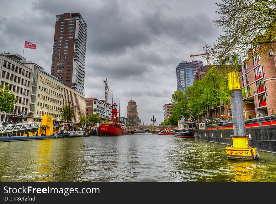 Concrete Buildings Beside Body of Water