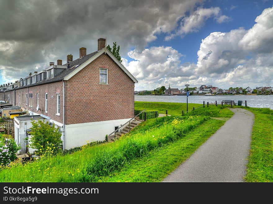 Brown House Near Body of Water